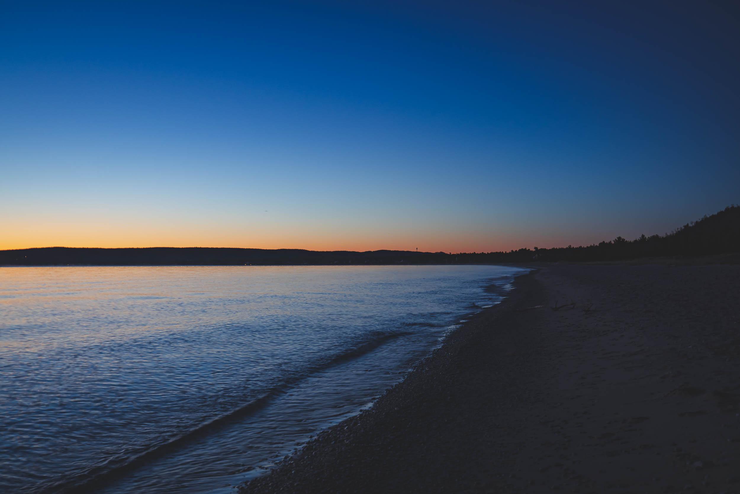 The shore of Lake Michigan during a colorful daybreak
