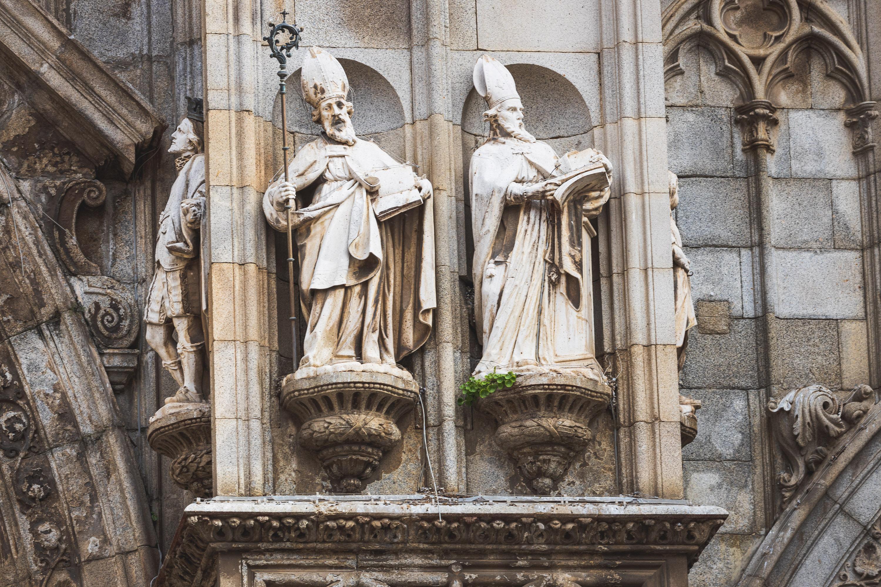 Architectural reliefs and statues outside Tolego Cathedral in Spain, carved into aging rock