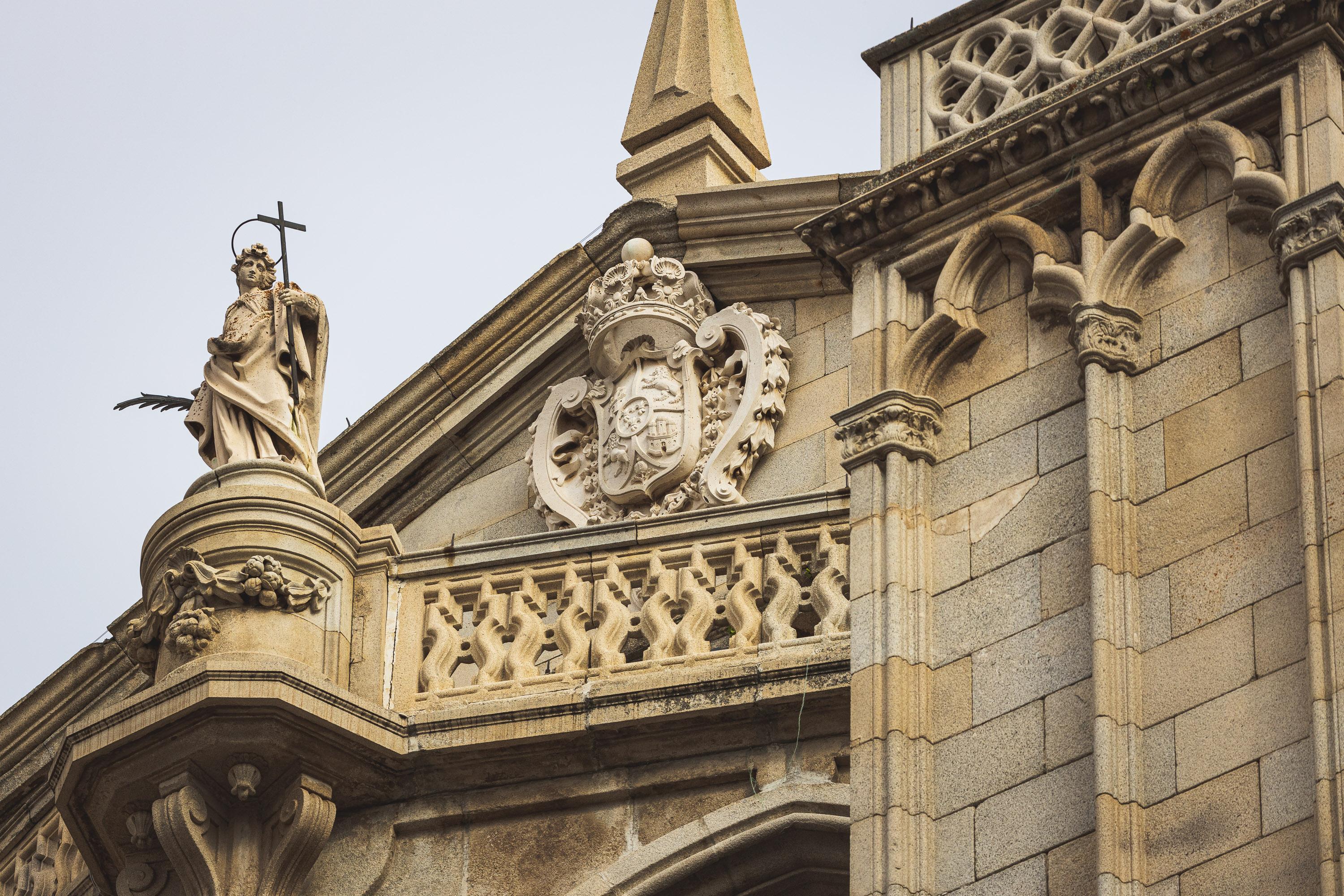 Architectural reliefs and statues outside Tolego Cathedral in Spain, carved into aging rock