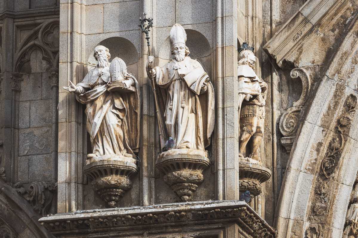 Architectural reliefs and statues outside Tolego Cathedral in Spain, carved into aging rock