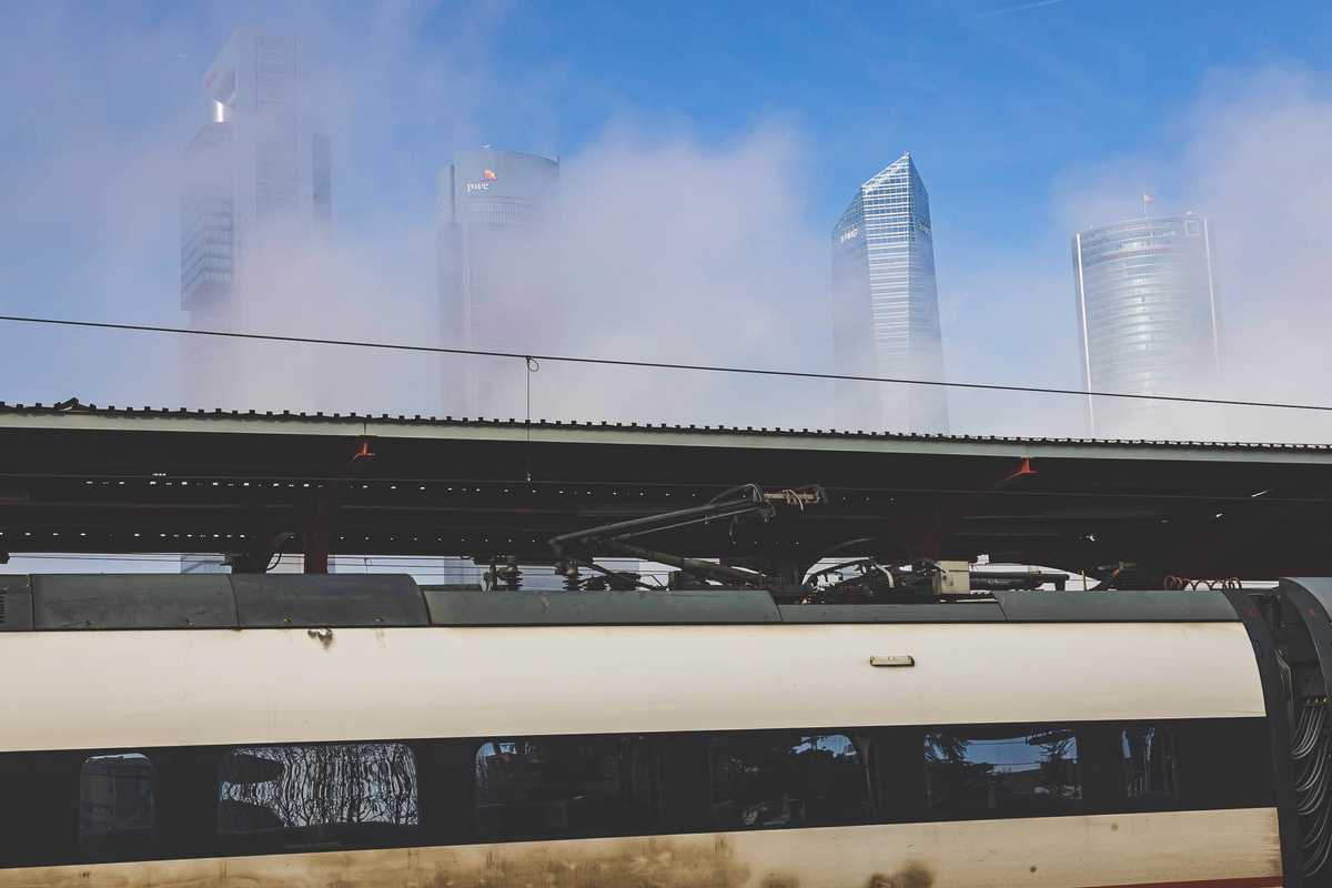 Fog clearing above the Madrid Chamartín station to reveal the Cuatro Torres