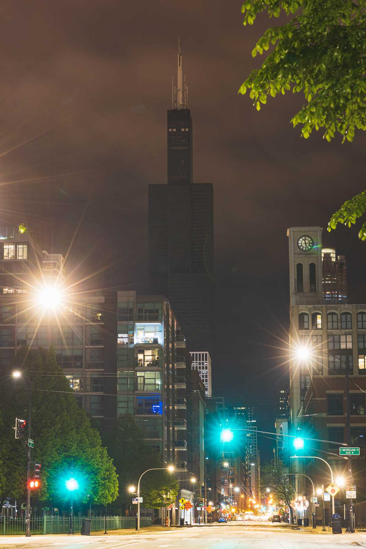 The Sears/Willis Tower without electricity as street lights light the street running past it.