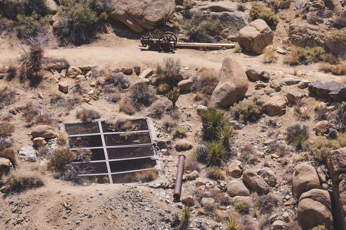 Old mine shafts with weathered equipment laying out